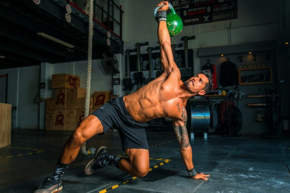 man in black shorts and black tank top doing push up